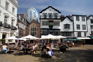 Visitors on Cathedral Green Exeter with over-sized RWC 2015 ball